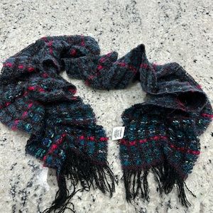 Multi coloured scarf. Approximately 40 inches.Non smoking pet free home.